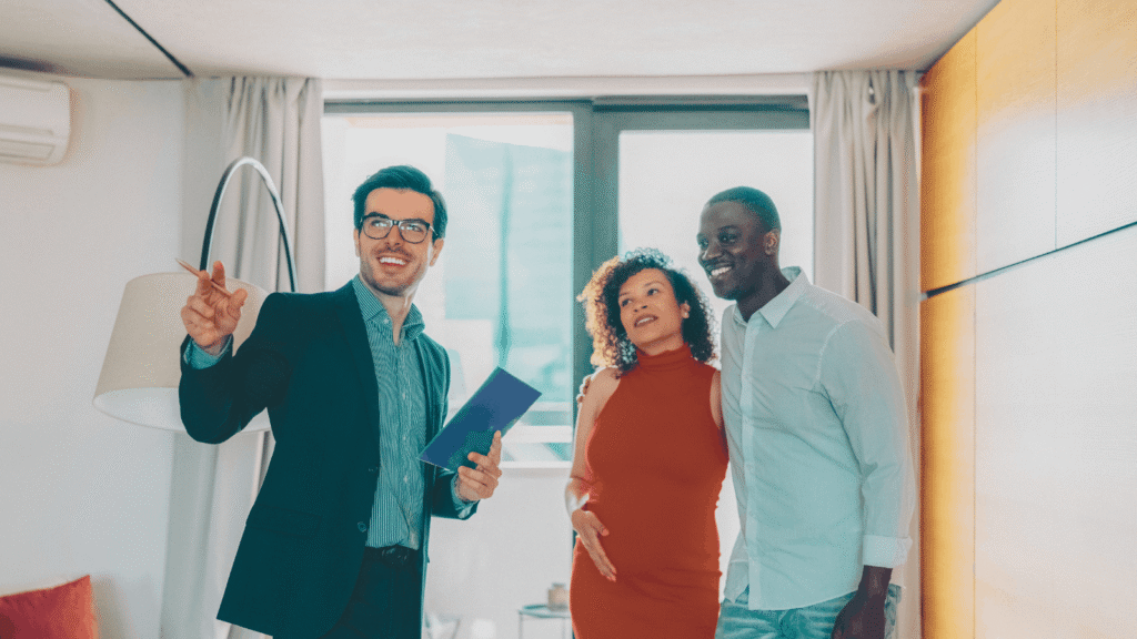 Real estate agent showing a modern apartment to prospective renters Interested Renters on House Tour