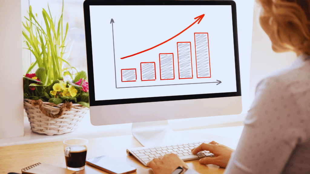 Person reviewing financial growth chart on desktop computer Long-term Rental Investment